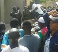 Protesting before Gambian soldiers