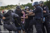 Israeli policemen arrest protesters as Palestinians living in Israel and left wing activists protest against the Israeli attack on Gaza in down town Haifa, July 18, 2014. (Photo: Activestills.org)